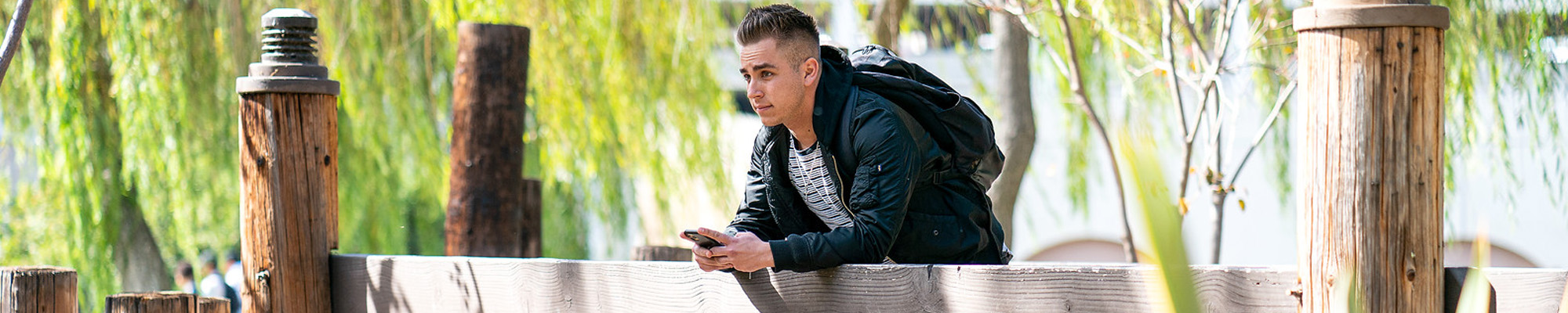 SDSU student on bridge at Scripps Cottage